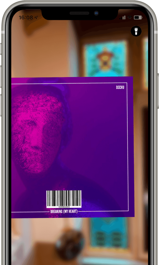 A CD back cover in front of an iPhone